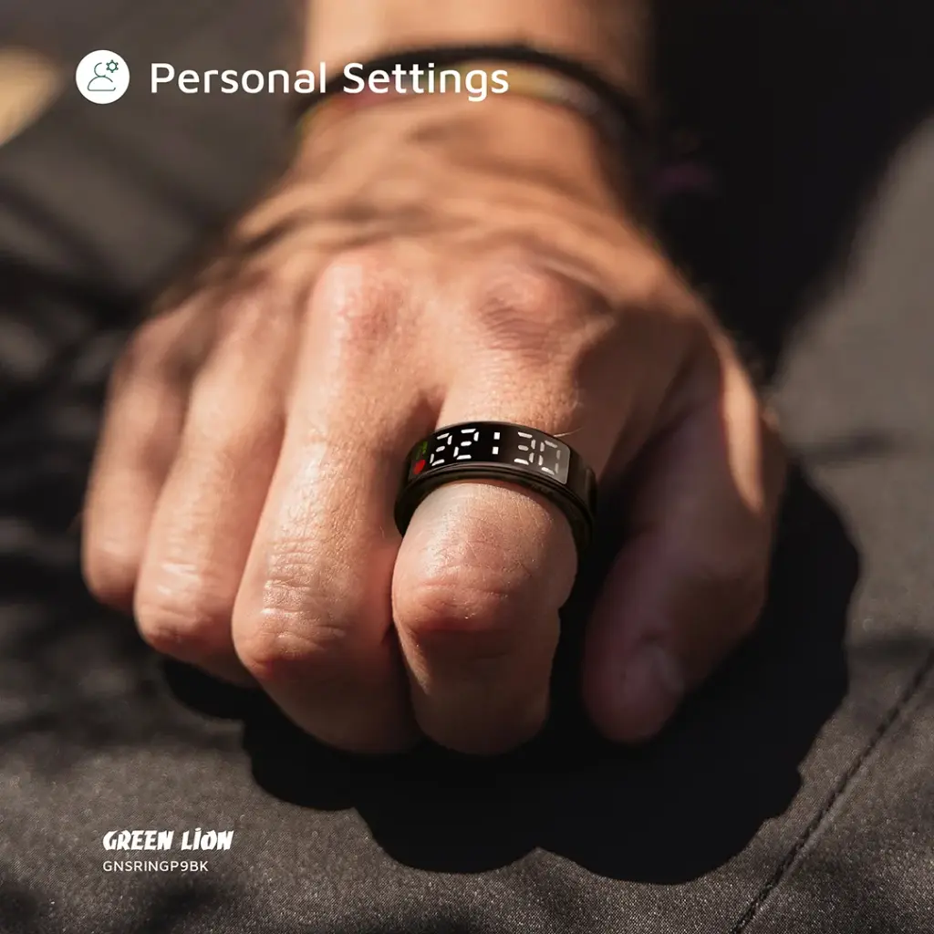 Smart ring on a person's finger with digital display, brand 'Green Lion' visible